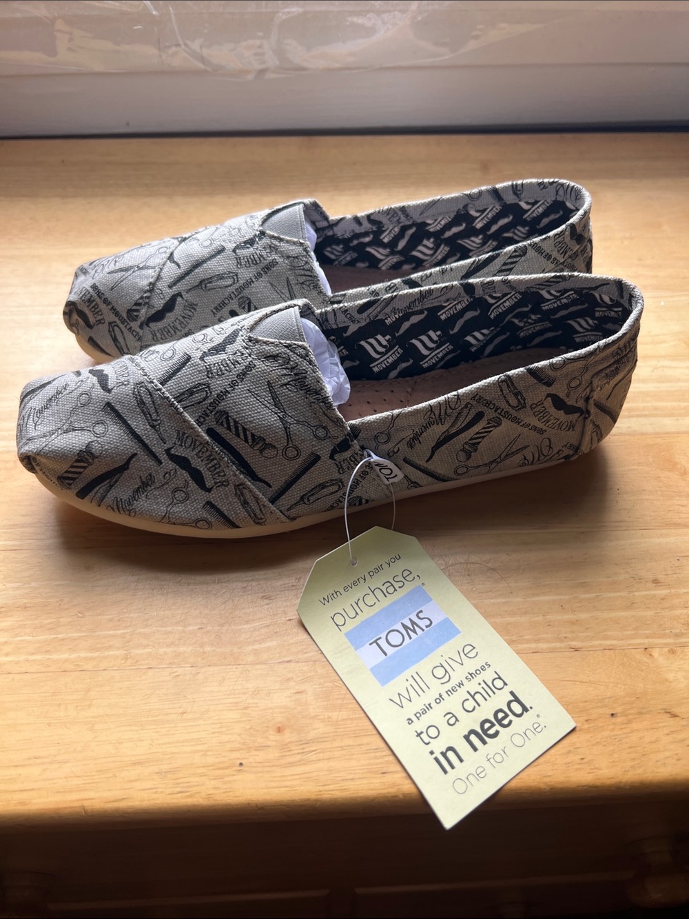 TOMS gray Canvas Slip-On Sneakers with Black Print limited edition